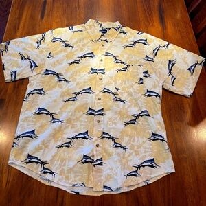 A XL mens Puritan brand shirt that is tan with a sword fish pattern.